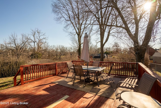 deck featuring outdoor dining area