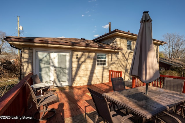 wooden deck featuring outdoor dining space