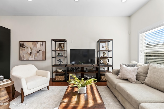 living area featuring wood finished floors and recessed lighting