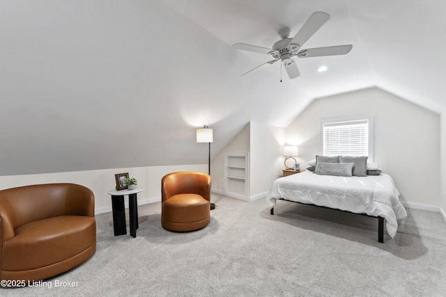 bedroom with a ceiling fan, carpet flooring, vaulted ceiling, and baseboards