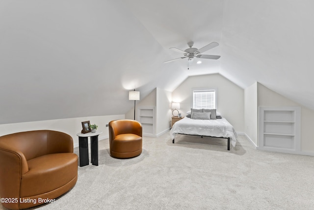 bedroom with lofted ceiling, ceiling fan, baseboards, and light colored carpet