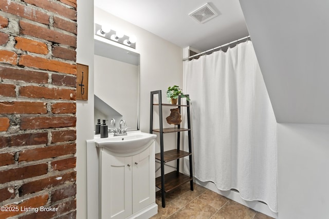 bathroom featuring visible vents and vanity