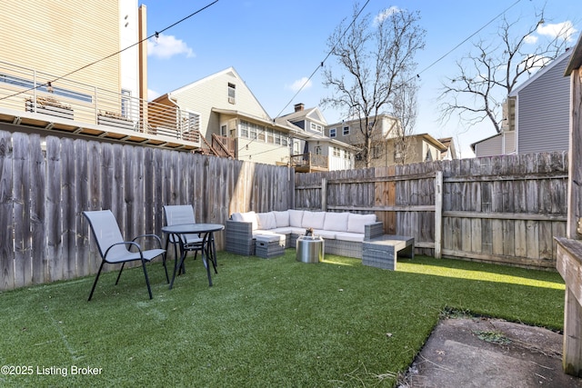 view of yard featuring outdoor lounge area and a fenced backyard