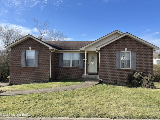 ranch-style home with brick siding and a front yard