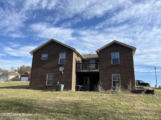 back of house with a yard, brick siding, cooling unit, and a wooden deck