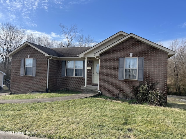 single story home with a front yard and brick siding