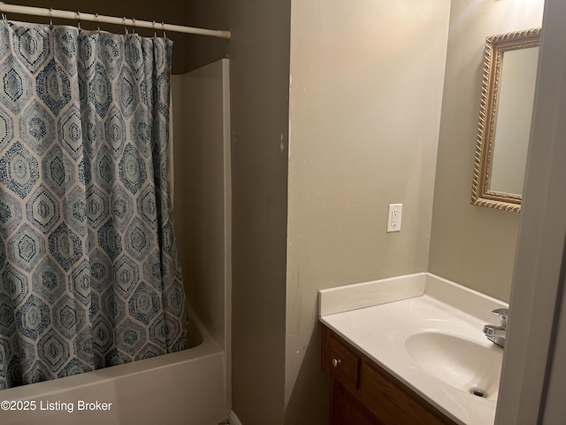 bathroom featuring shower / tub combo and vanity