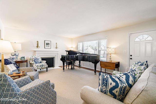 living area with carpet flooring and a fireplace with flush hearth