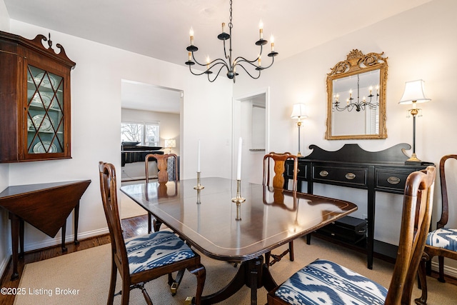 dining space with a chandelier