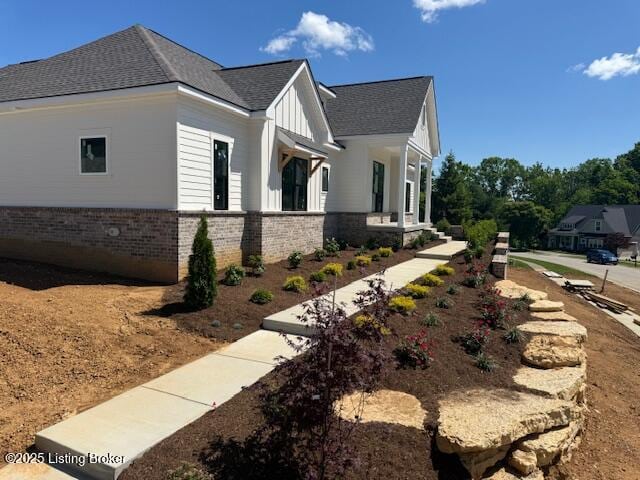 3015 Heather Green Blvd, La Grange, KY 40031 - view of side of home featuring a shingled roof and brick siding