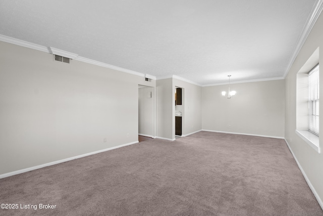 empty room featuring baseboards, ornamental molding, visible vents, and an inviting chandelier