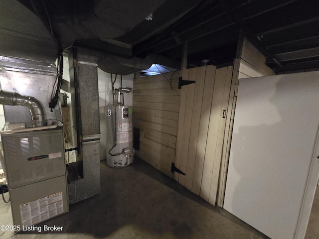 unfinished basement with water heater and wooden walls