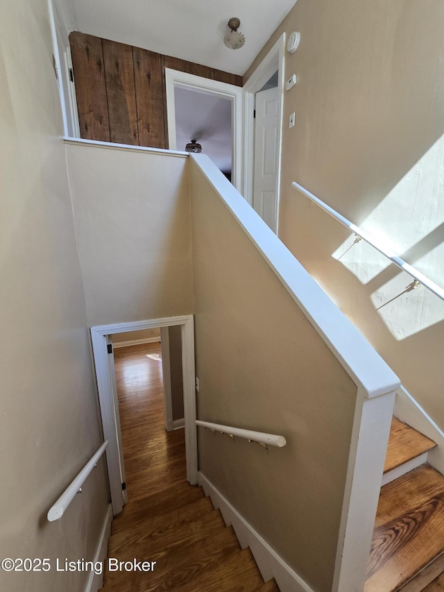 staircase featuring wood finished floors