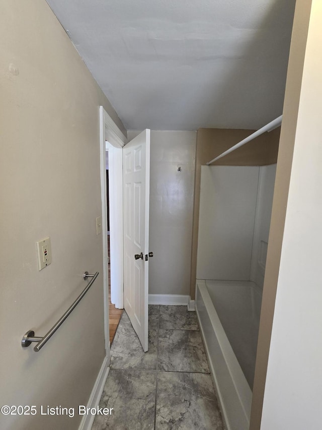 full bathroom featuring baseboards