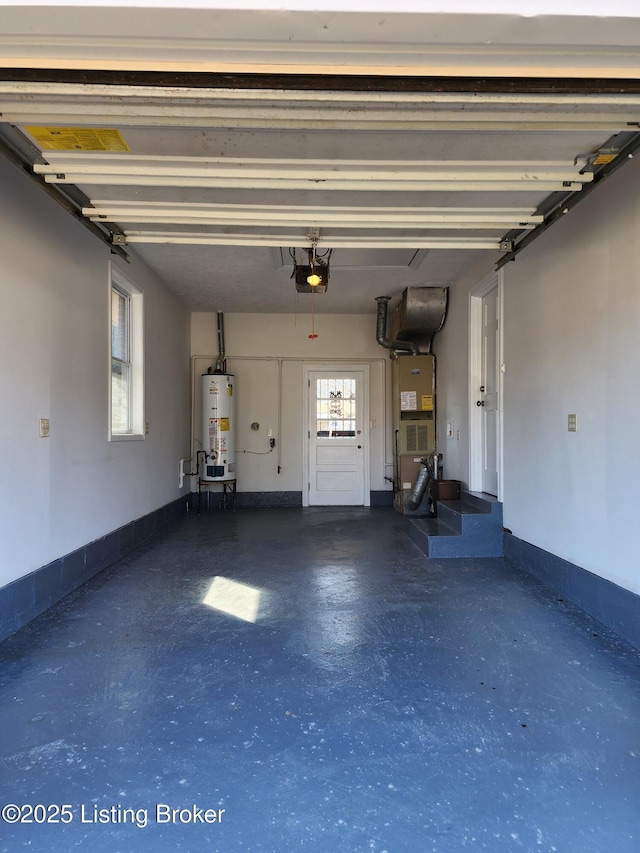 garage featuring heating unit, water heater, baseboards, and a garage door opener