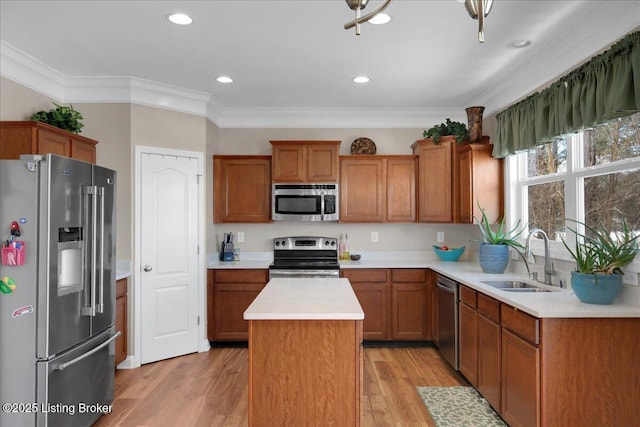 kitchen featuring a center island, brown cabinets, stainless steel appliances, light countertops, and a sink