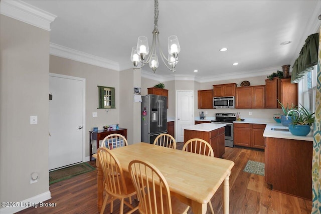 dining area featuring dark wood-style floors, a chandelier, and ornamental molding