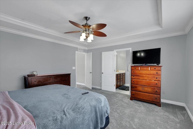 bedroom featuring baseboards, light colored carpet, ceiling fan, ornamental molding, and ensuite bathroom