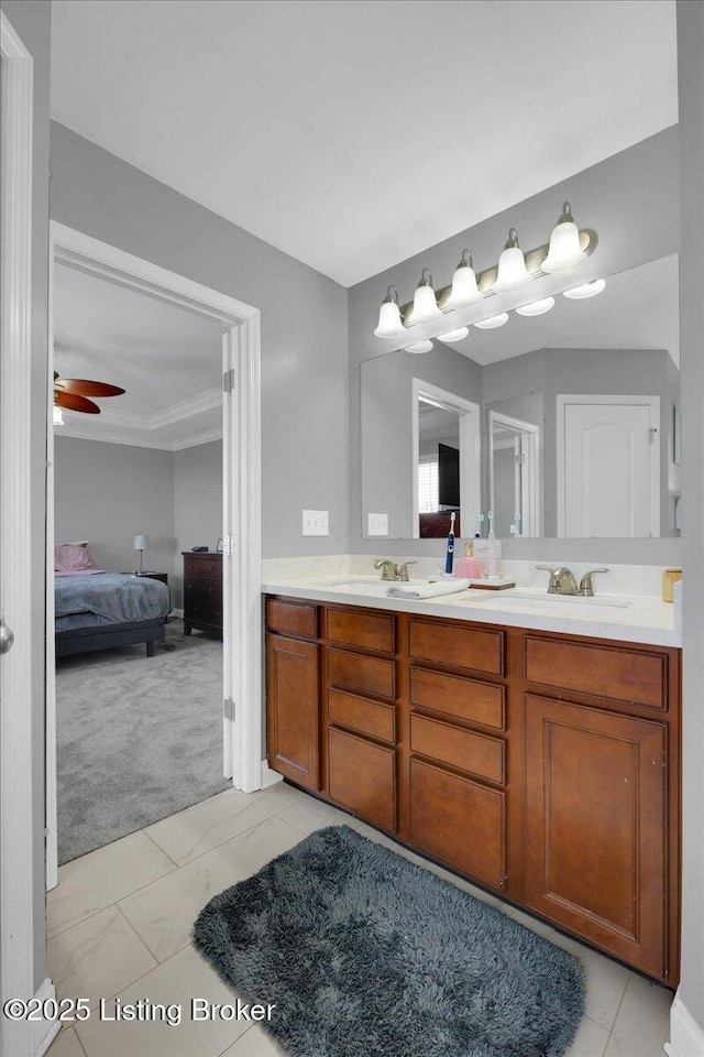 full bath featuring ceiling fan, a sink, ensuite bath, and double vanity