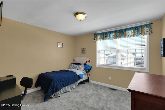 bedroom featuring carpet, visible vents, and baseboards