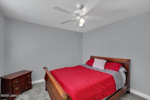 bedroom featuring light carpet, ceiling fan, and baseboards