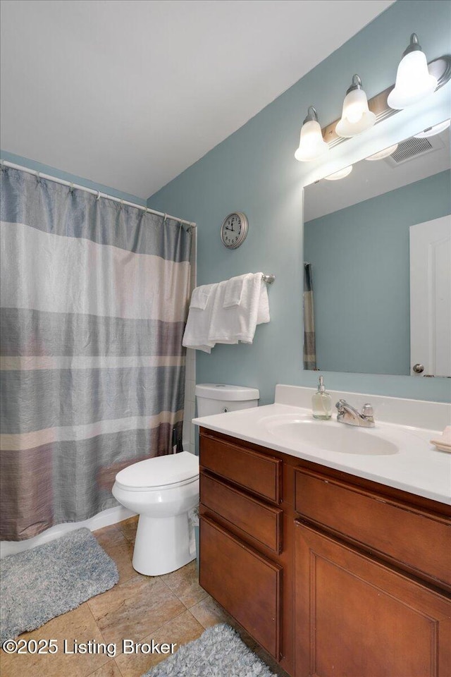 full bath featuring toilet, tile patterned flooring, visible vents, and vanity