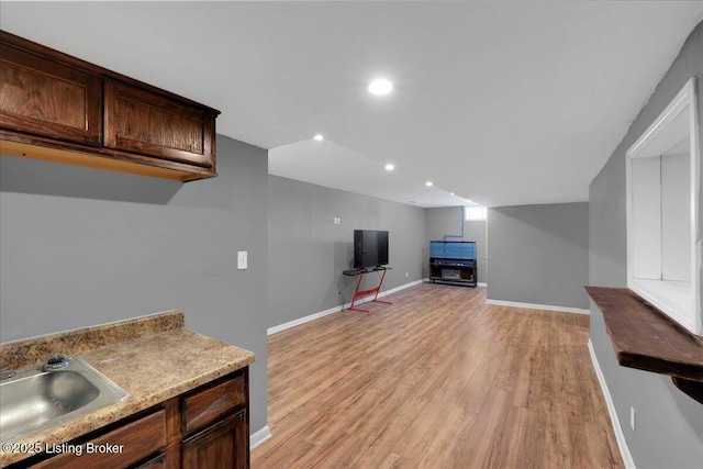 interior space with recessed lighting, baseboards, and light wood finished floors