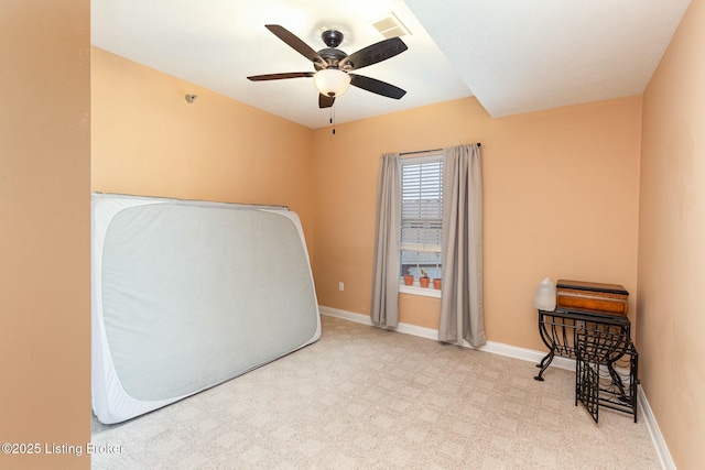 carpeted bedroom featuring visible vents, baseboards, and a ceiling fan