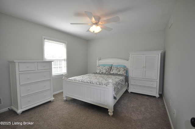 bedroom featuring baseboards, dark carpet, and ceiling fan