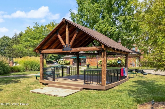 surrounding community with a gazebo, a lawn, and a wooden deck