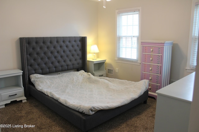 bedroom featuring visible vents