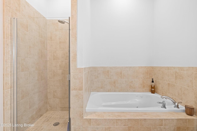 full bath featuring a garden tub and a shower stall