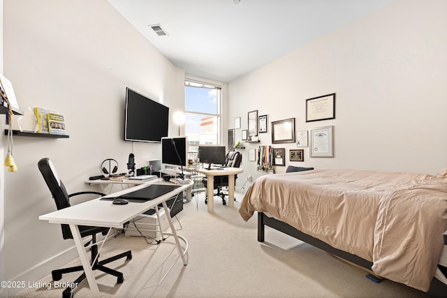 bedroom with light colored carpet, visible vents, and baseboards