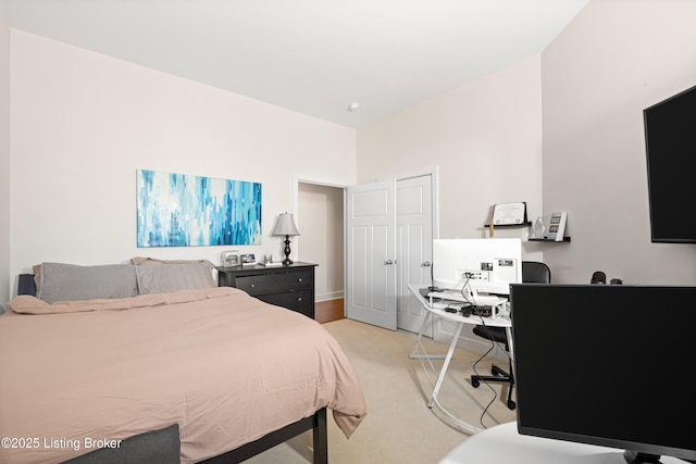 bedroom with light colored carpet