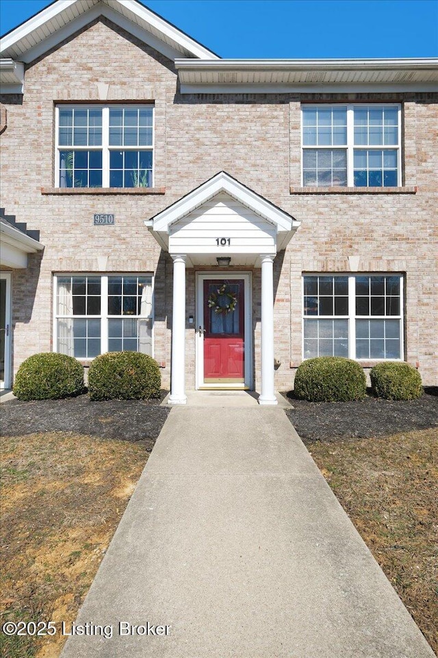 multi unit property featuring brick siding