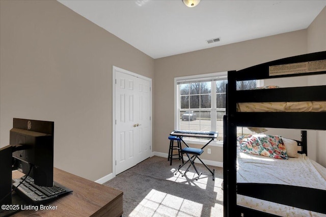 bedroom featuring carpet, visible vents, and baseboards