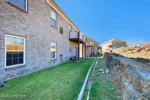 view of yard with a balcony