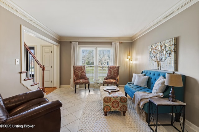 living area with crown molding, baseboards, and light tile patterned floors