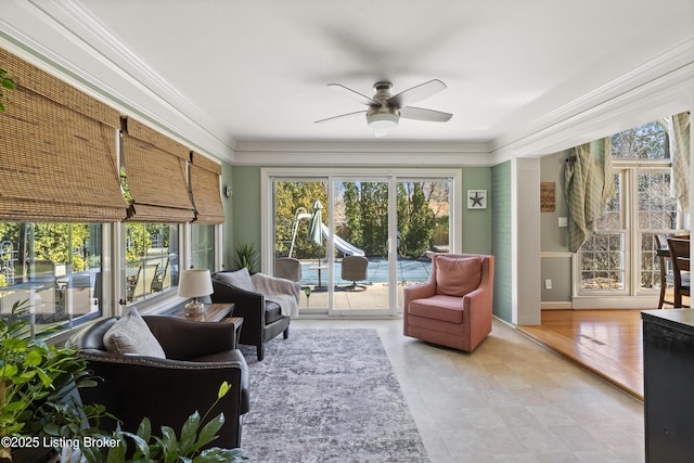 sunroom / solarium with ceiling fan and a wealth of natural light