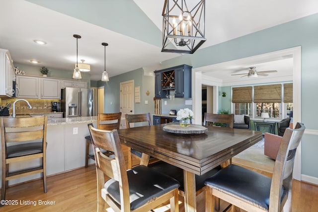 dining space with light wood-style flooring, a ceiling fan, and recessed lighting