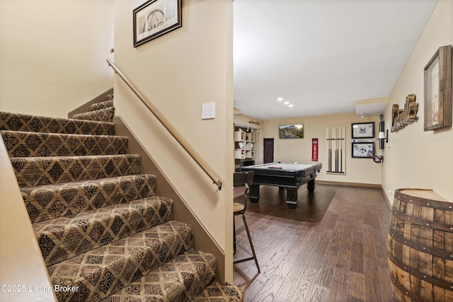 stairway featuring baseboards, billiards, and hardwood / wood-style floors