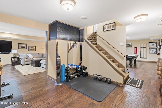 workout area with wood finished floors and baseboards