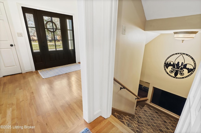 foyer with stairs and wood finished floors