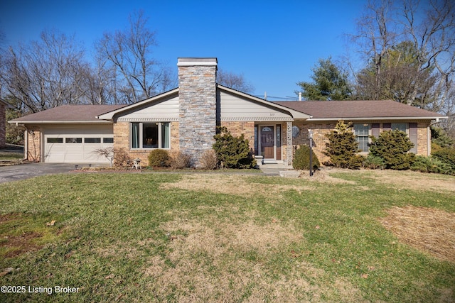 view of front of house featuring an attached garage, brick siding, driveway, a chimney, and a front yard