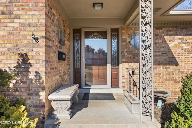 property entrance with brick siding