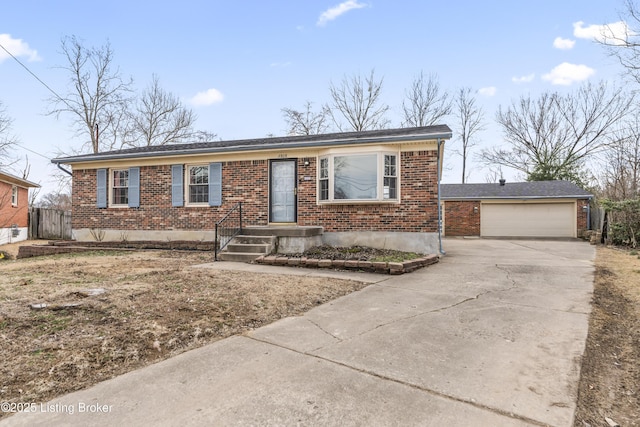 single story home featuring a garage, brick siding, and fence