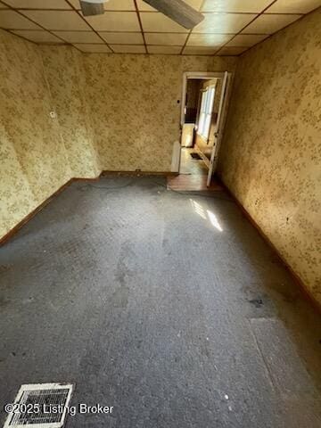 unfurnished room with a paneled ceiling