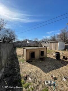 view of shed with fence