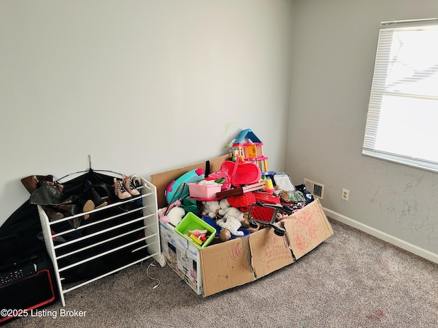 carpeted bedroom with visible vents and baseboards