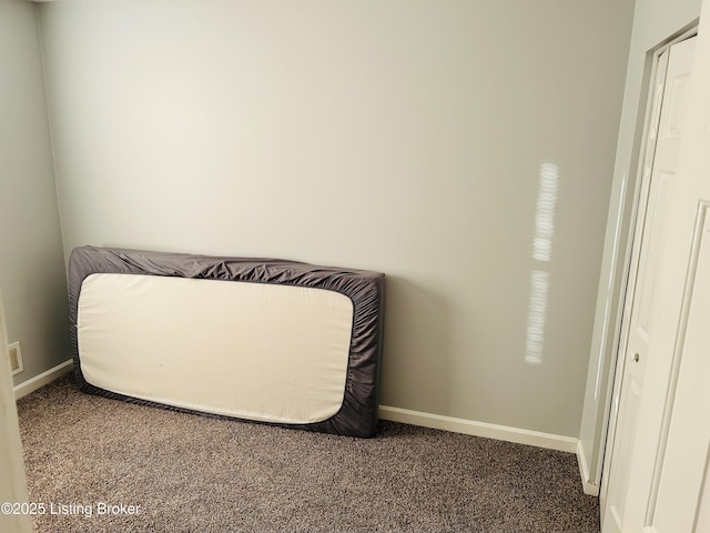 interior space with carpet flooring and baseboards